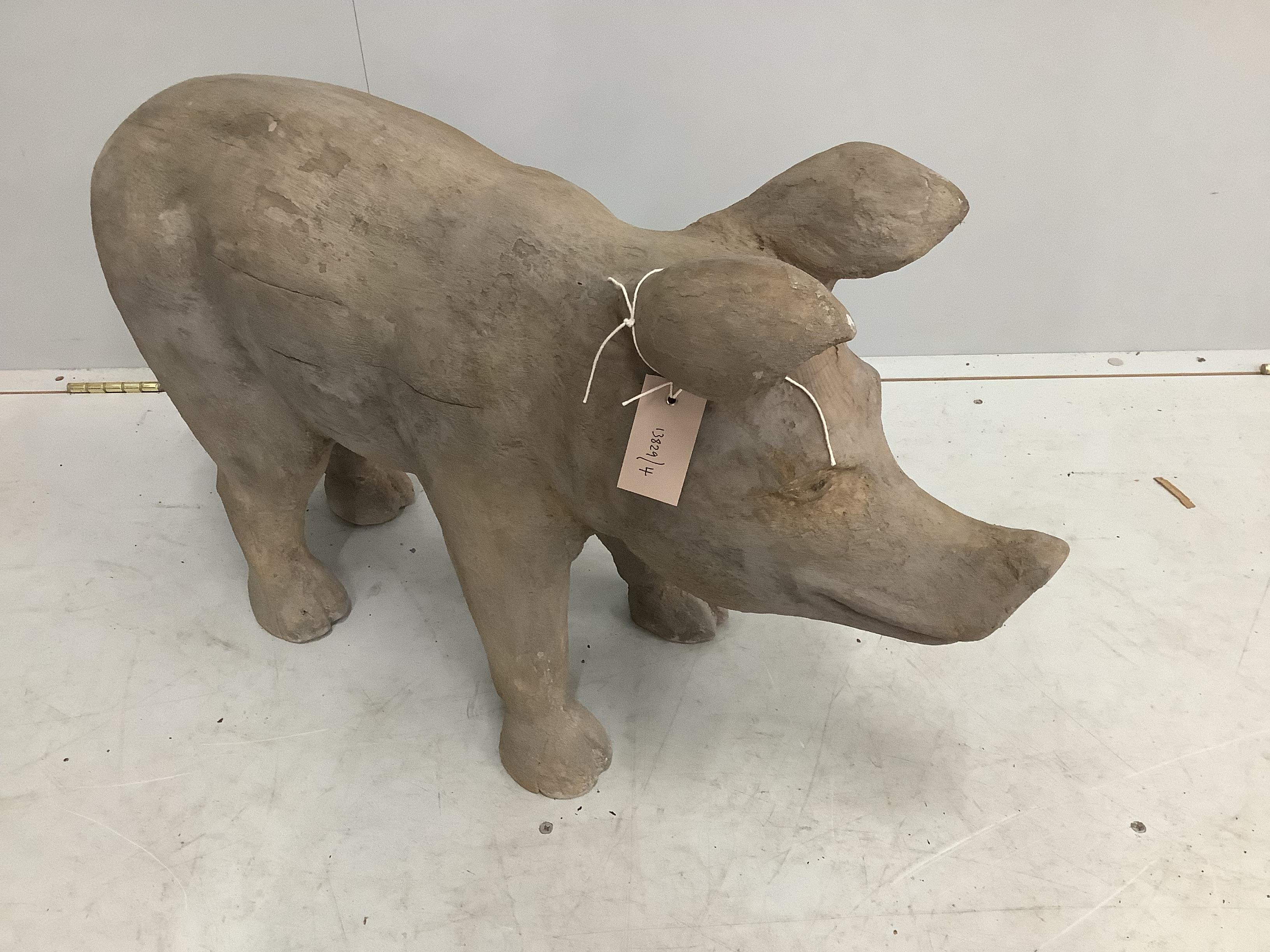 A carved wood model of a standing pig, length 82cm